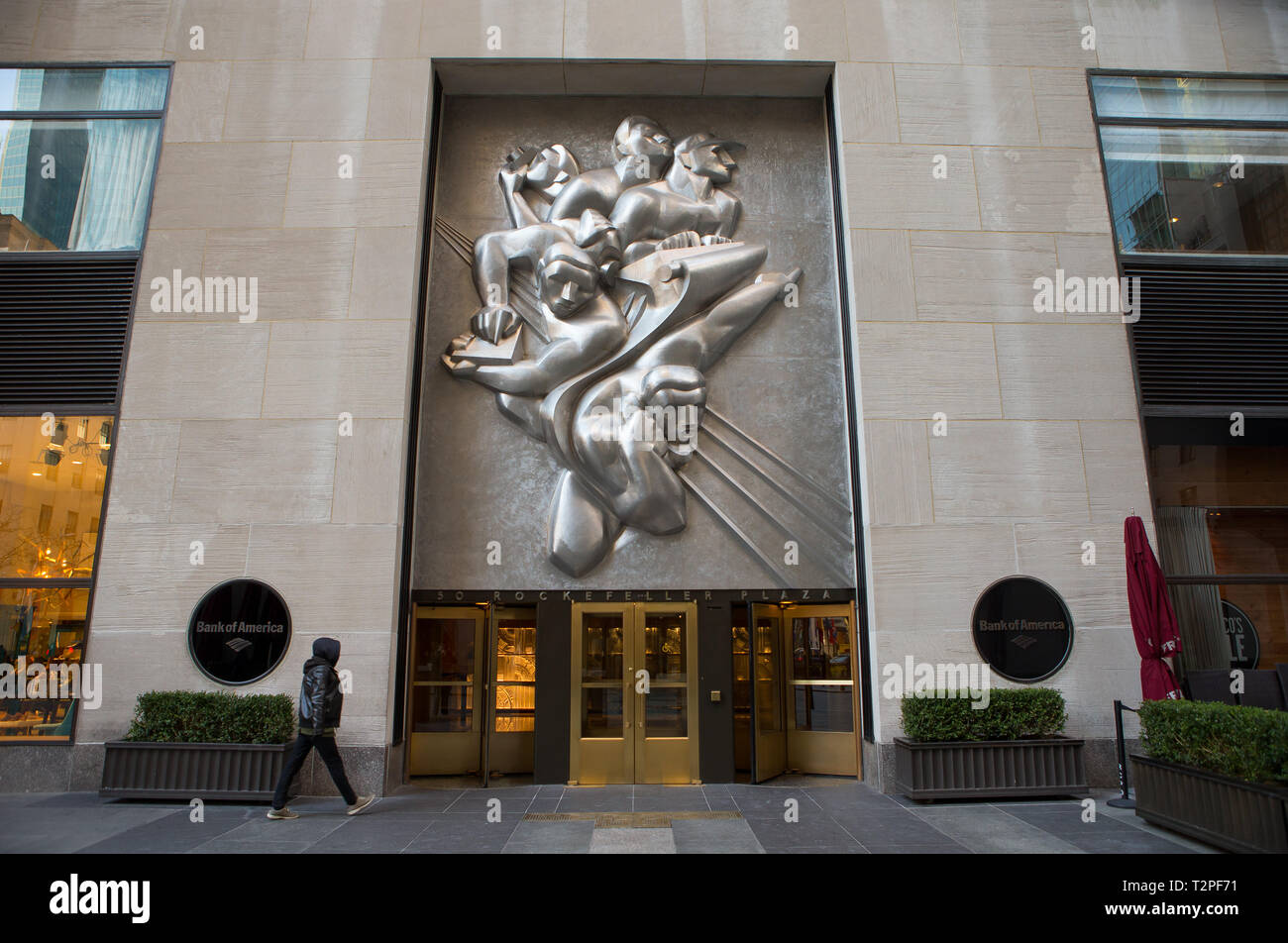 Isamu Noguchi's 10-short-ton (8.9-long-ton) stainless steel panel, News,  located above the entrance to 50 Rockefeller Plaza (formerly the Associated  P Stock Photo - Alamy