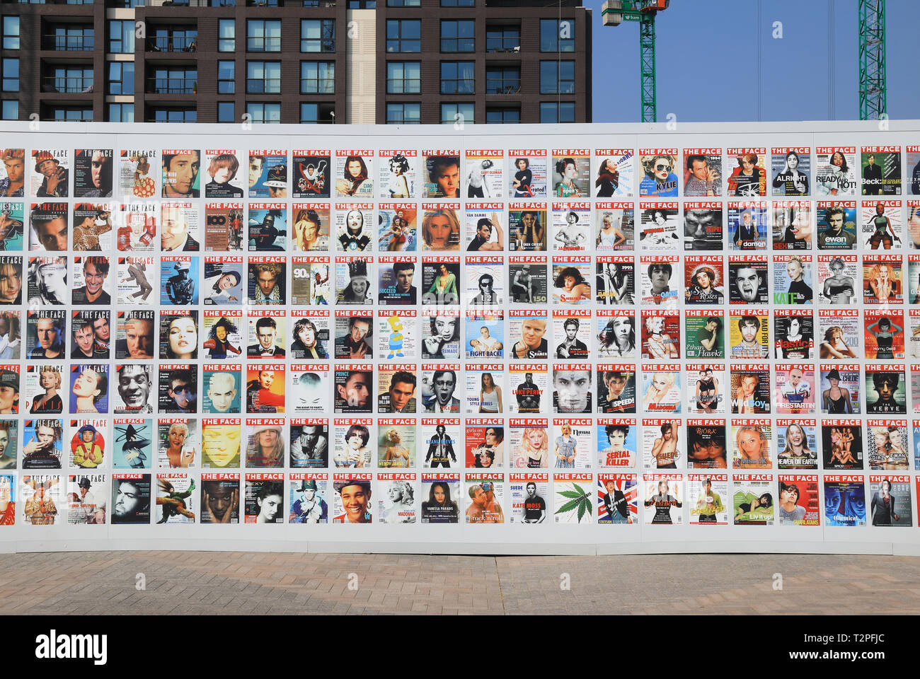 Exhibition of historic Face magazine covers on side of Lewis Cubitt Square at Kings Cross, north London, UK Stock Photo