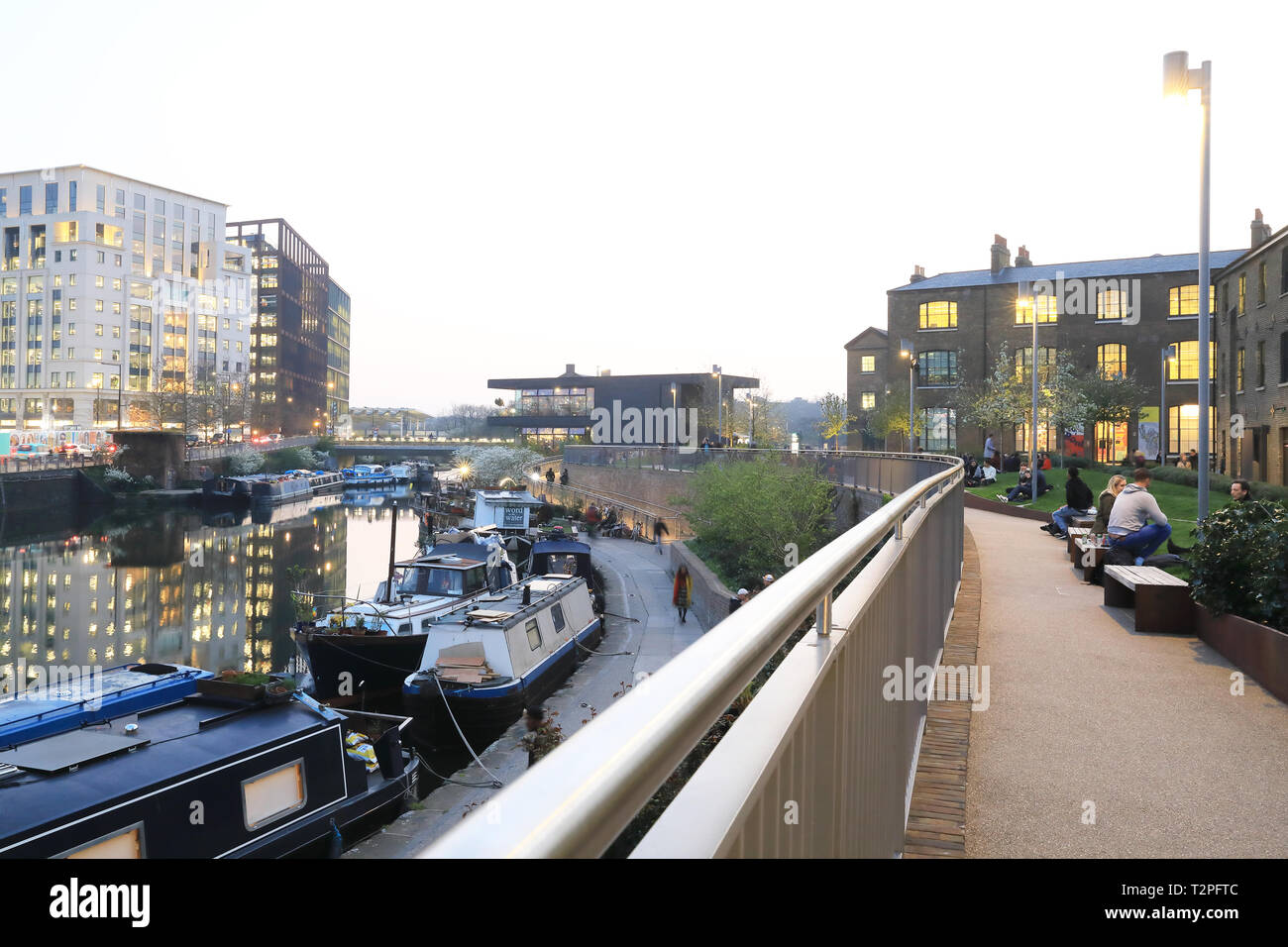Wharf Road Gardens at dusk in spring, leading to Granary Square at