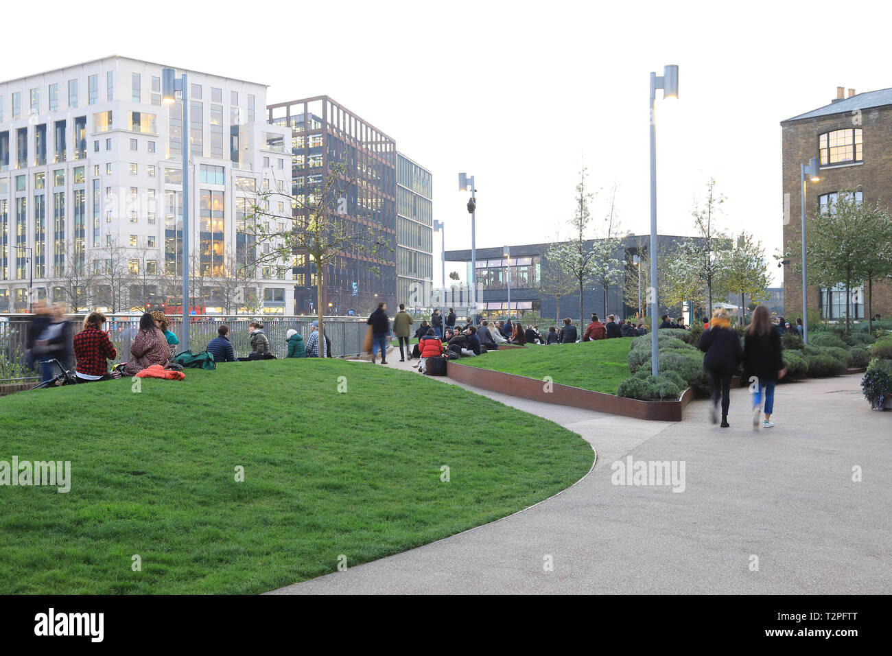 Wharf Road Gardens at dusk in spring, leading to Granary Square at