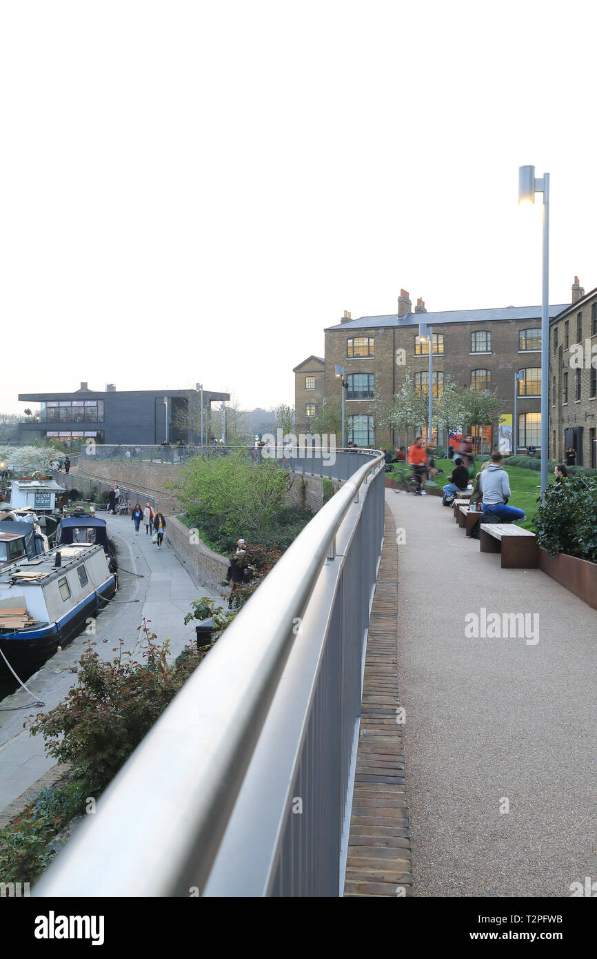 Wharf Road Gardens at dusk in spring, leading to Granary Square at