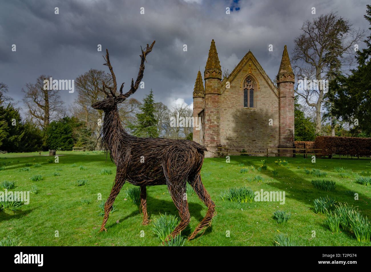 A wicker model of a deer on the Moot Hill stands in front of the chapel at the Palace of Scone, Perthshire, Scotland Stock Photo