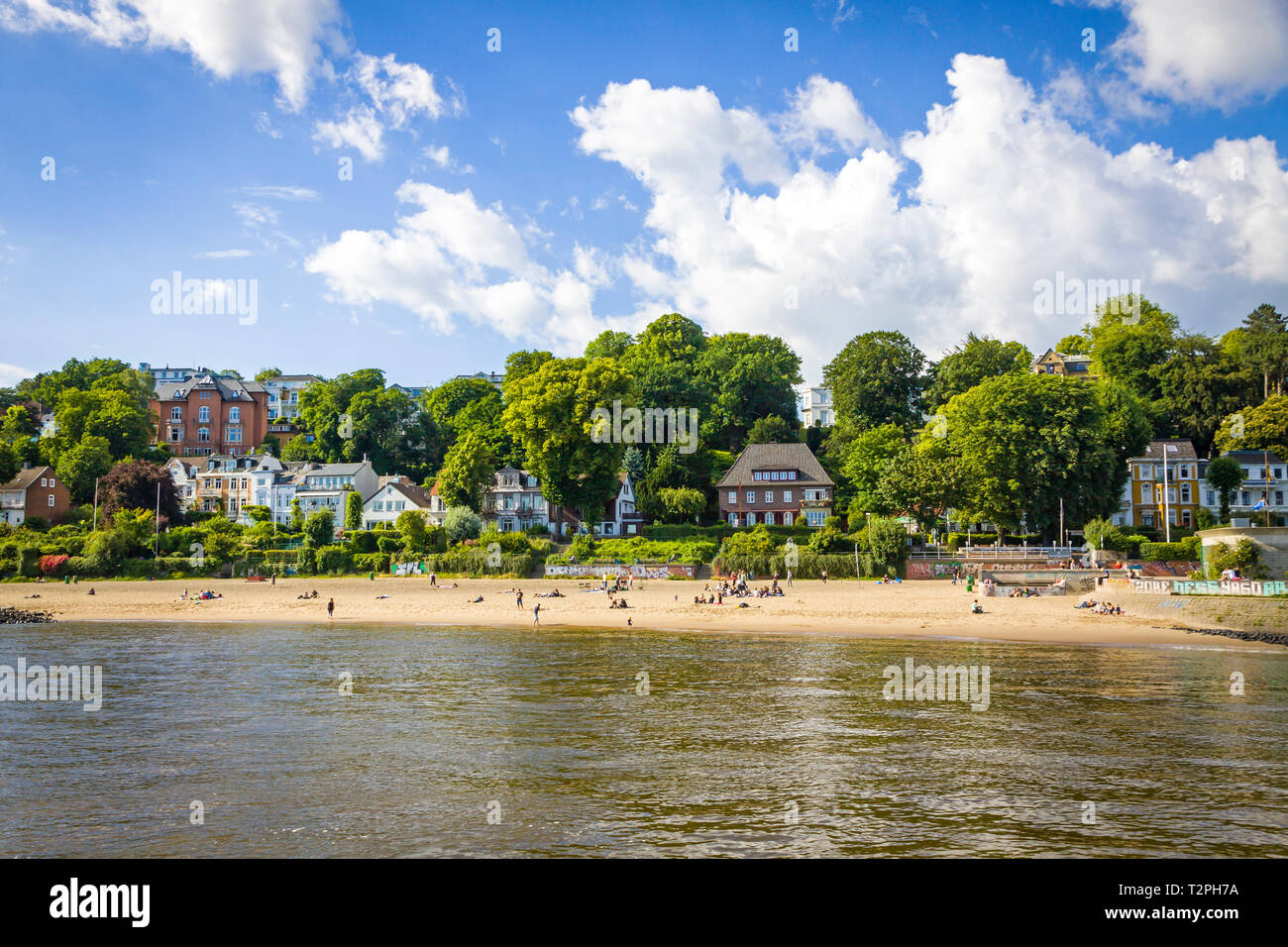 Hamburg, Germany - June 25, 2014: Summer view of the beach (Strand Oevelgoenne) on the Elbe river in Oevelgoenne district of Hamburg city. Popular pla Stock Photo