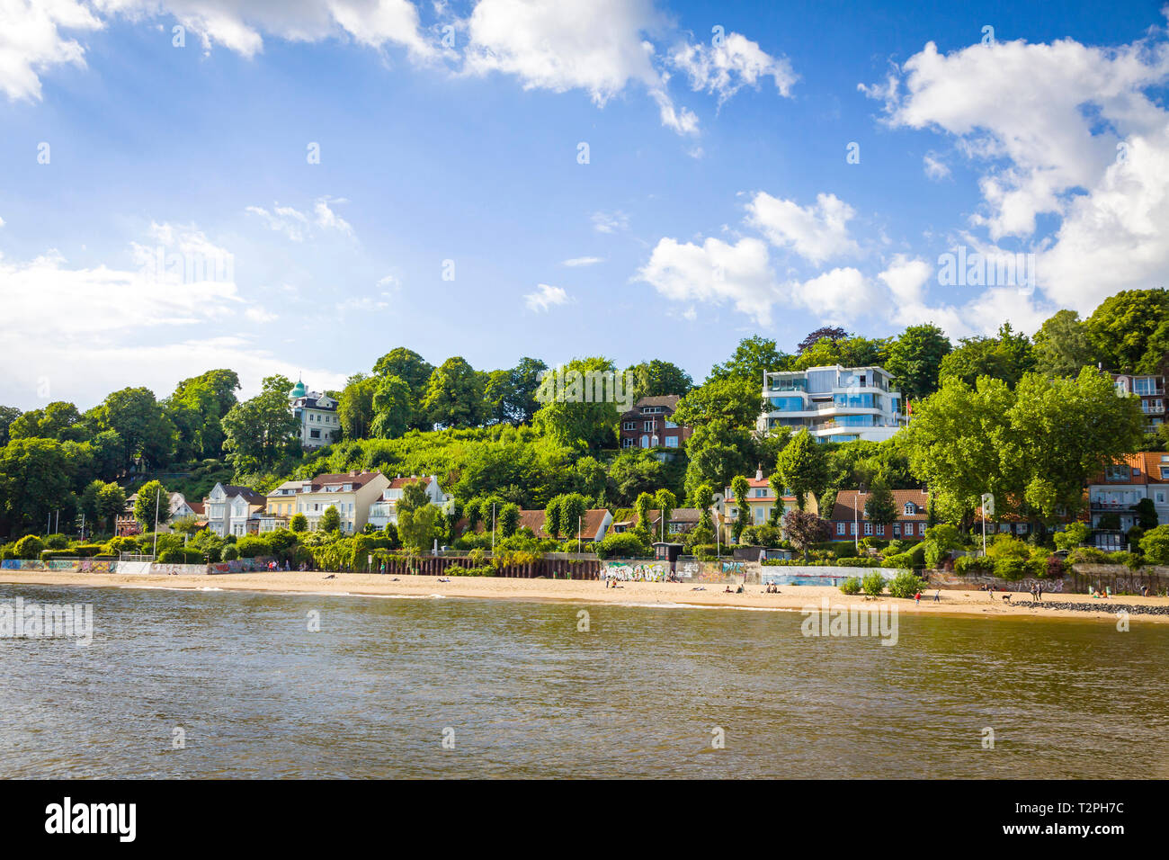 Hamburg, Germany - June 25, 2014: Summer view of the beach (Strand Oevelgoenne) on the Elbe river in Oevelgoenne district of Hamburg city. Popular pla Stock Photo