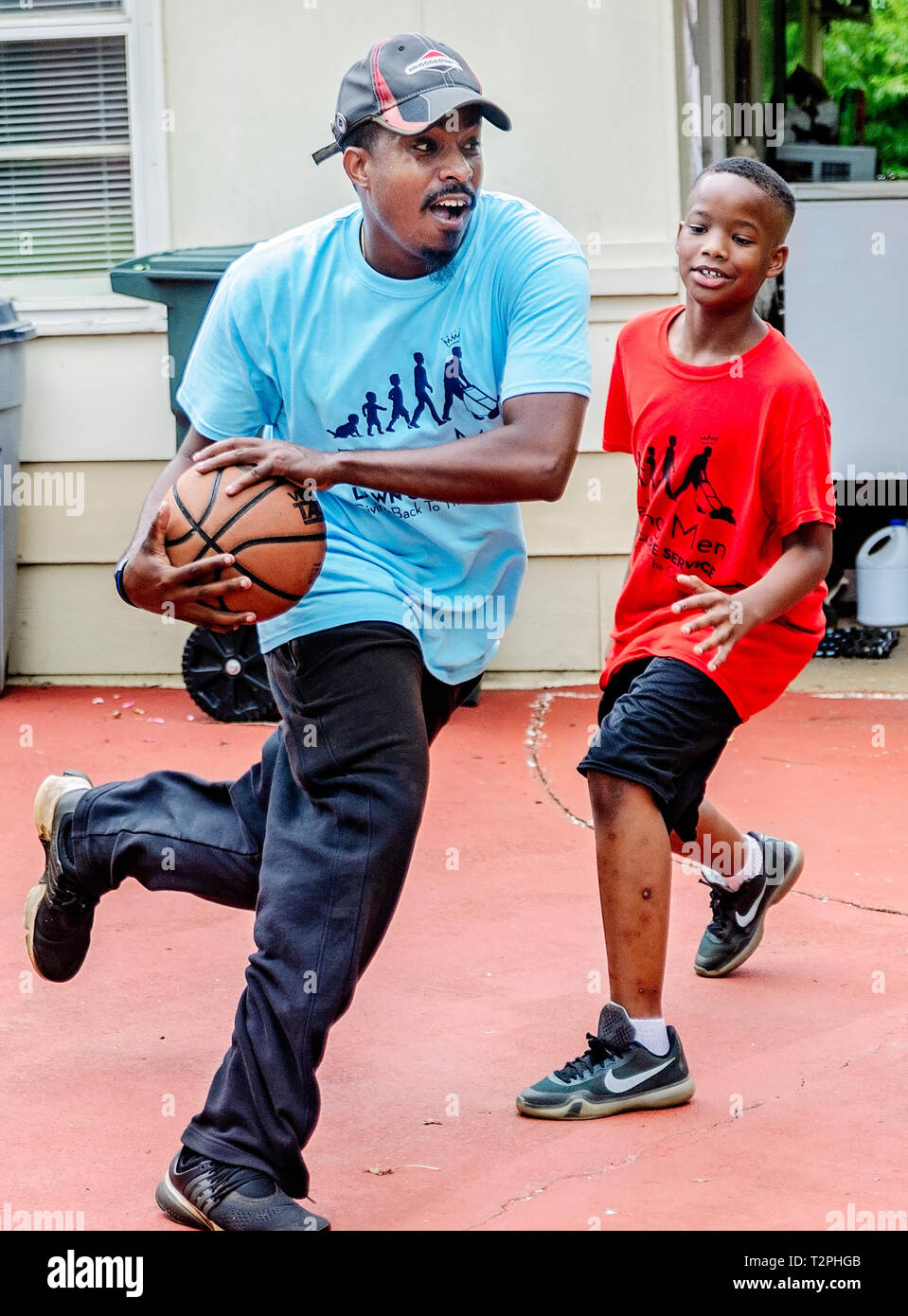 Rodney Smith Jr. dribbles a basketball as Quay Knight watches, Aug. 1, 2018, in Huntsville, Alabama. Stock Photo