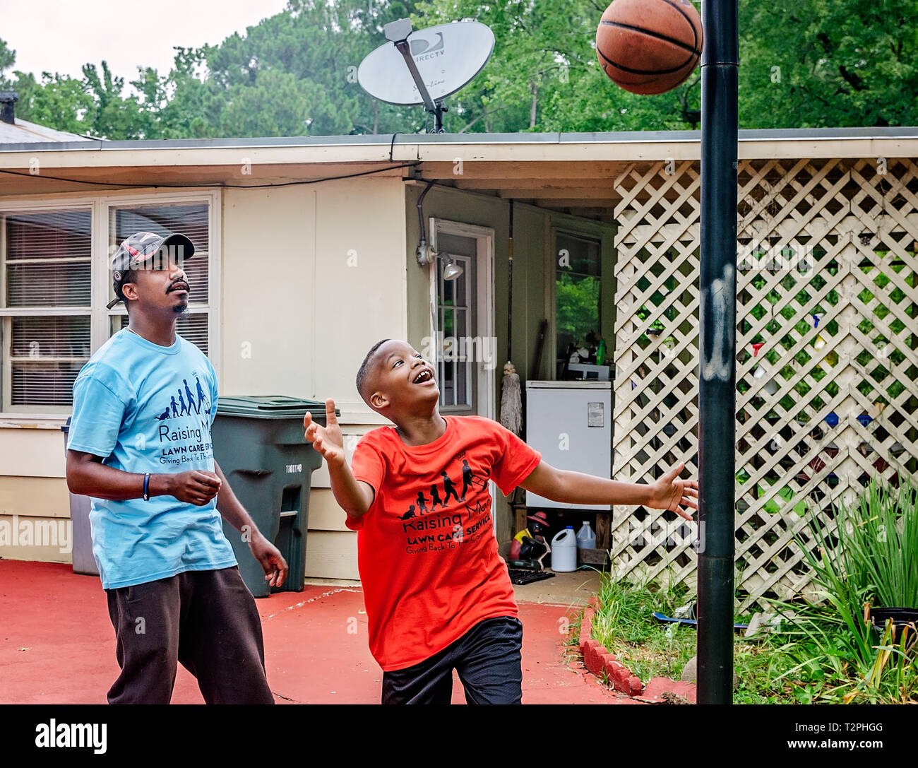 Rodney Smith Jr. watches as Quay Knight makes a basket, Aug. 1, 2018, in Huntsville, Alabama. Stock Photo