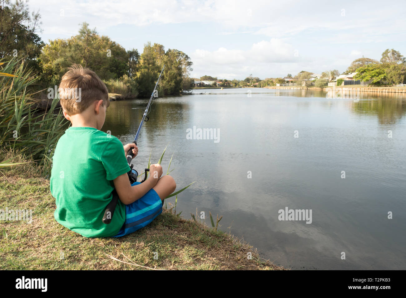 6 year old boy fishing at a local pond. Beachmere Queensland Australia. Stock Photo