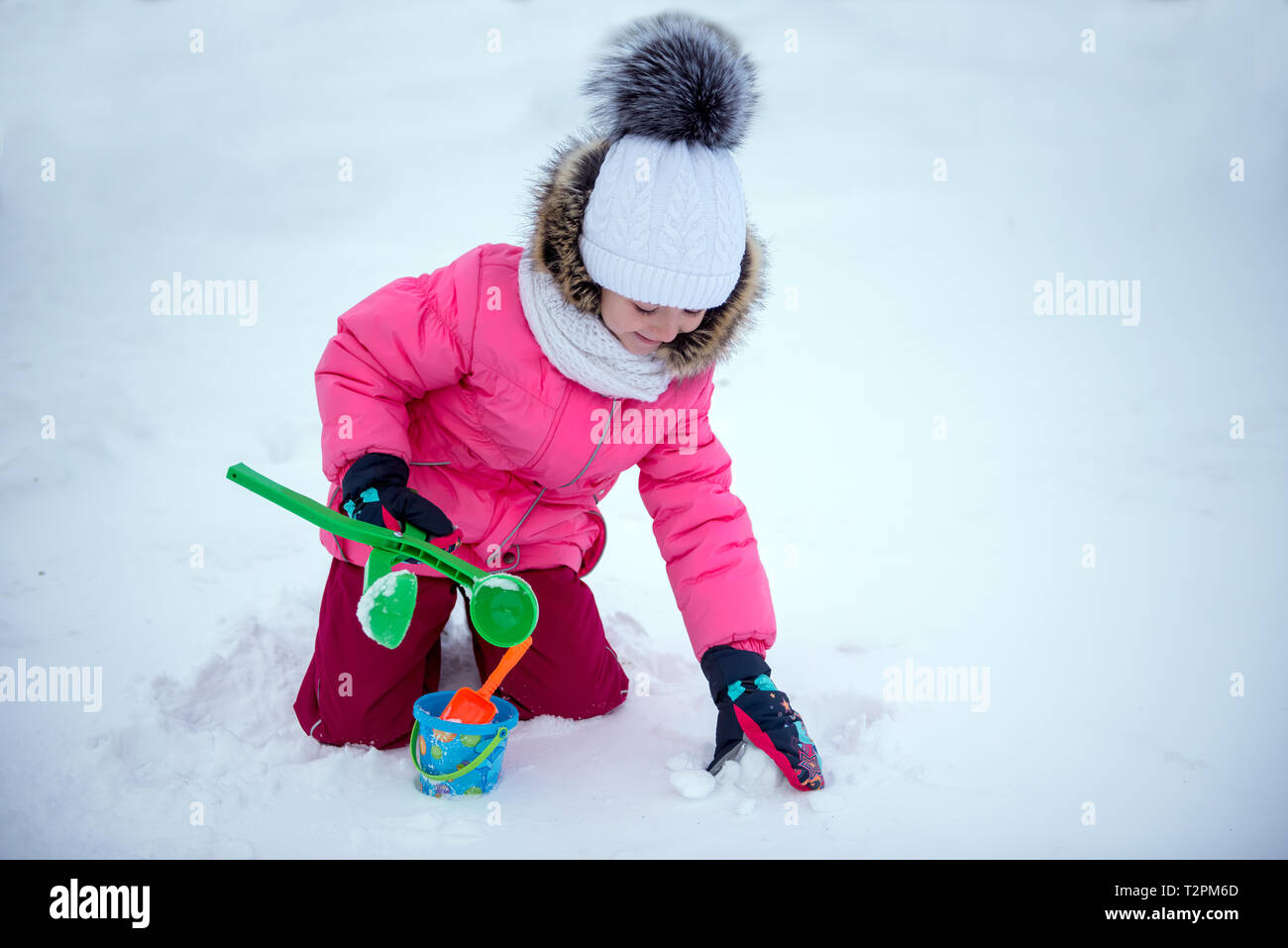 Child Making Snowballs Girl playing with snow and making snowballs Stock Photo - Alamy