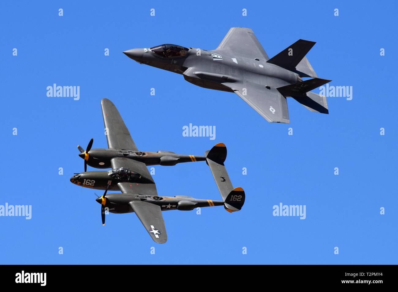 Air Show in Arizona features a heritage flight with a F22 and a P38 Stock Photo