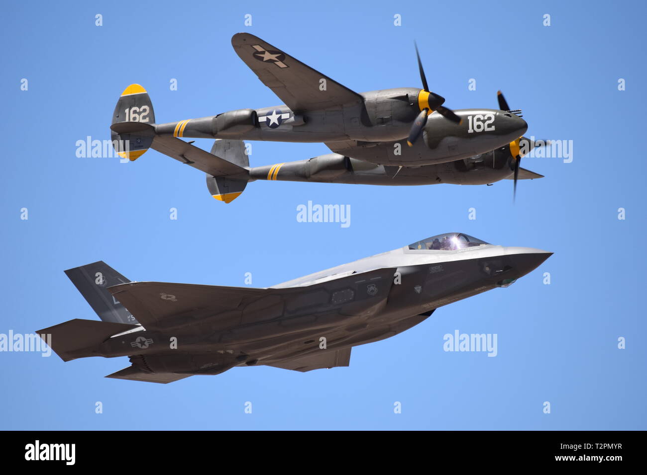 Air Show in Arizona features a heritage flight with a F22 and a P38 Stock Photo