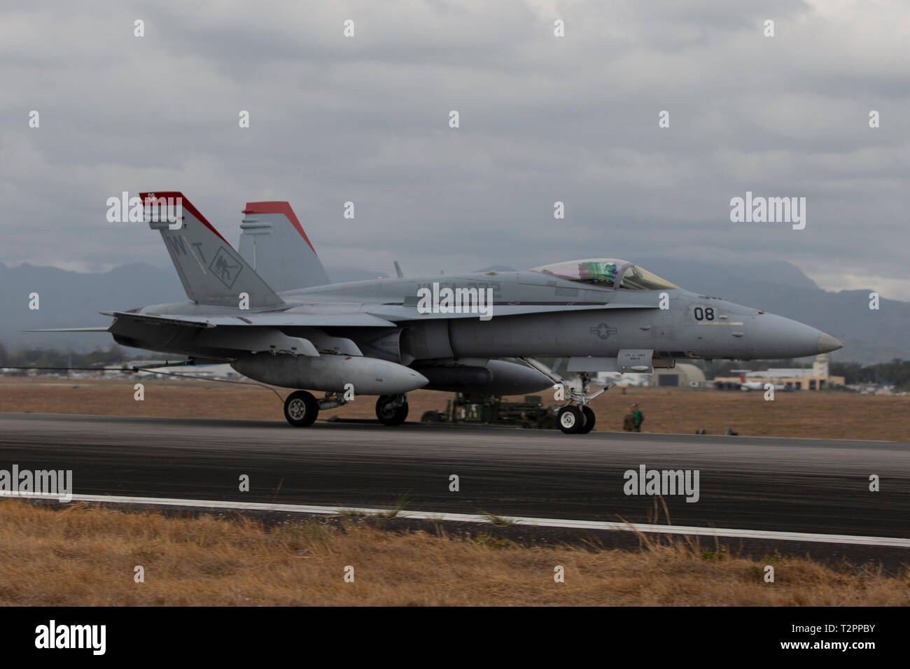A U.S. Marine Corps F/A 18C Hornet aircraft with Marine Fighter Attack Squadron 232 tests an M31 Expeditionary Arresting Gear System at Clark Air Base, Philippines, April 2, 2019, during Exercise Balikatan. Balikatan is an annual exercise between the U.S. and the Philippines and comes from a Tagalog phrase meaning 'shoulder-to-shoulder,' representing the partnership between the two countries. The exercise promotes regional security and humanitarian efforts for U.S. allies and partners. (U.S. Marine Corps photo by Lance Cpl. Tyler Harmon) Stock Photo