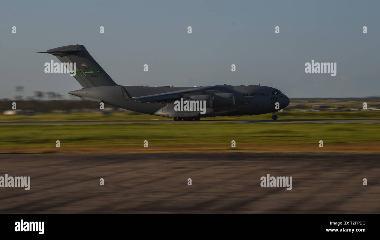 A C-17 Globemaster III departs Beira Airport, Mozambique, April 2, 2019, after delivering relief supplies, equipment and personnel supporting Combined Joint Task Force-Horn of Africa (CJTF-HOA) for the U.S. Department of Defense’s (DoD) relief effort in the Republic of Mozambique and surrounding areas following Cyclone Idai. Teams from CJTF-HOA, which is leading DoD support to relief efforts in Mozambique, began immediate preparation to respond following a call for assistance from the U.S. Agency for International Development’s Disaster Assistance Response Team. (U.S. Air Force photo by Staff  Stock Photo