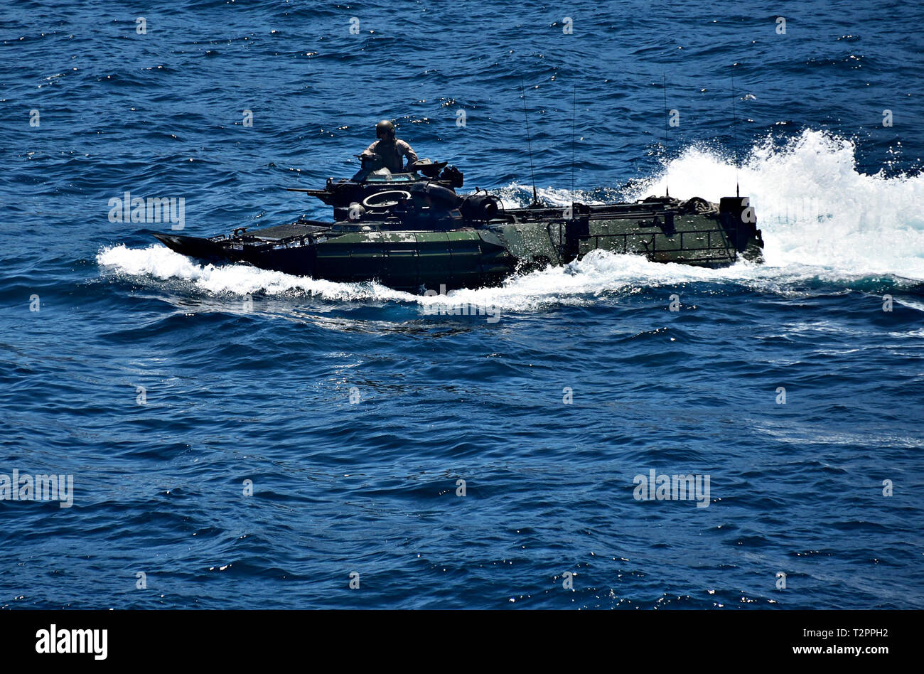 190402-N-RI884-4017 SUBIC BAY, Philippines (April 2, 2019) A Marine Corps assault amphibious vehicle (AAV) transits alongside the amphibious assault ship USS Wasp (LHD 1) in support of Exercise Balikatan 2019. Exercise Balikatan, in its 35th iteration, is an annual U.S., Philippine military training exercise focused on a variety of missions, including humanitarian assistance and disaster relief, counter-terrorism, and other combined military operations. (U.S. Navy photo by Mass Communication Specialist 1st Class Daniel Barker) Stock Photo