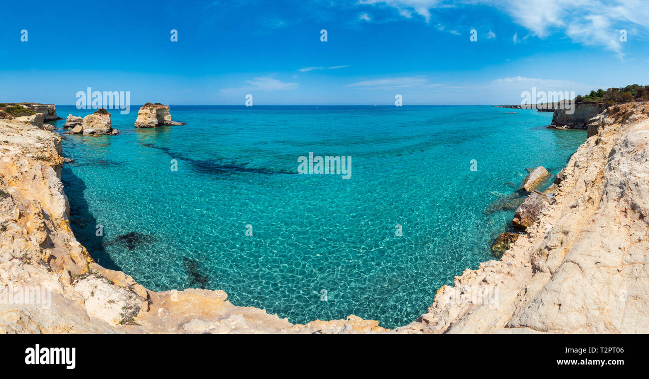 Picturesque seascape with white rocky cliffs, sea bay, islets and faraglioni at beach Spiaggia della Punticeddha, Salento Adriatic sea coast, Puglia,  Stock Photo