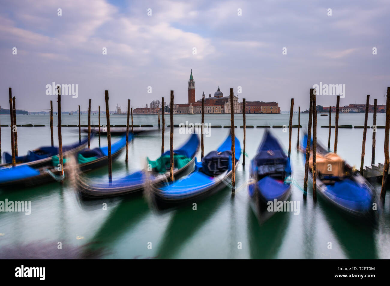 Gondolas moored in Piazza San Marco with San Giorgio Maggiore church in the background Stock Photo