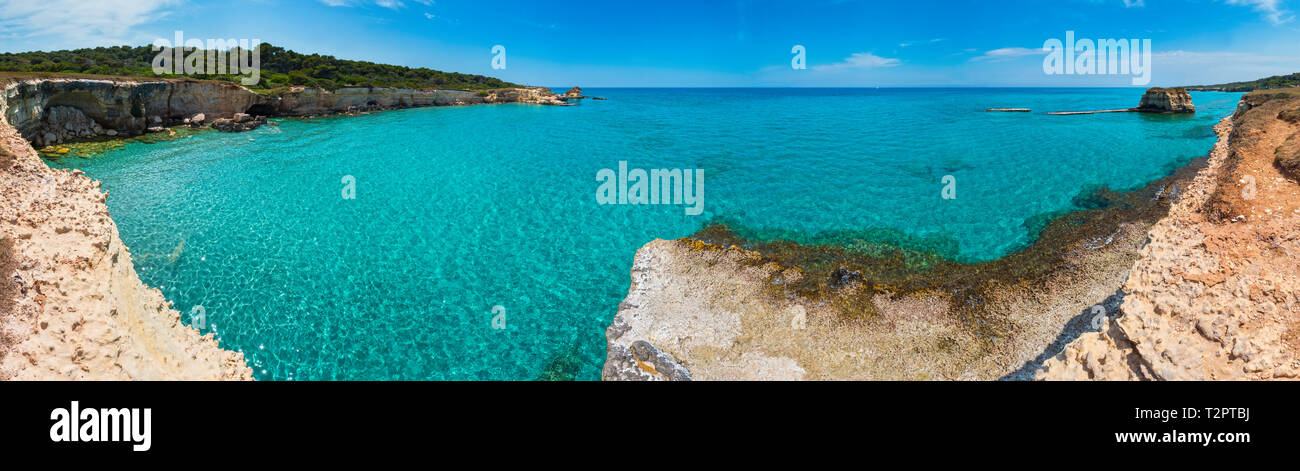 Picturesque seascape with white rocky cliffs, sea bay, islets and faraglioni at beach Spiaggia della Punticeddha, Salento Adriatic sea coast, Puglia,  Stock Photo