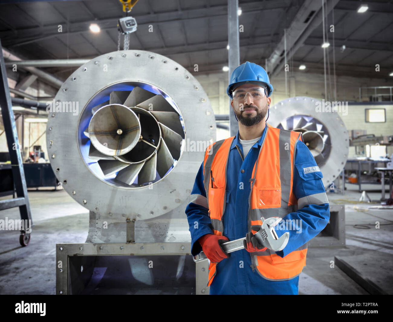 Composite image of engineer in fabrication workshop Stock Photo