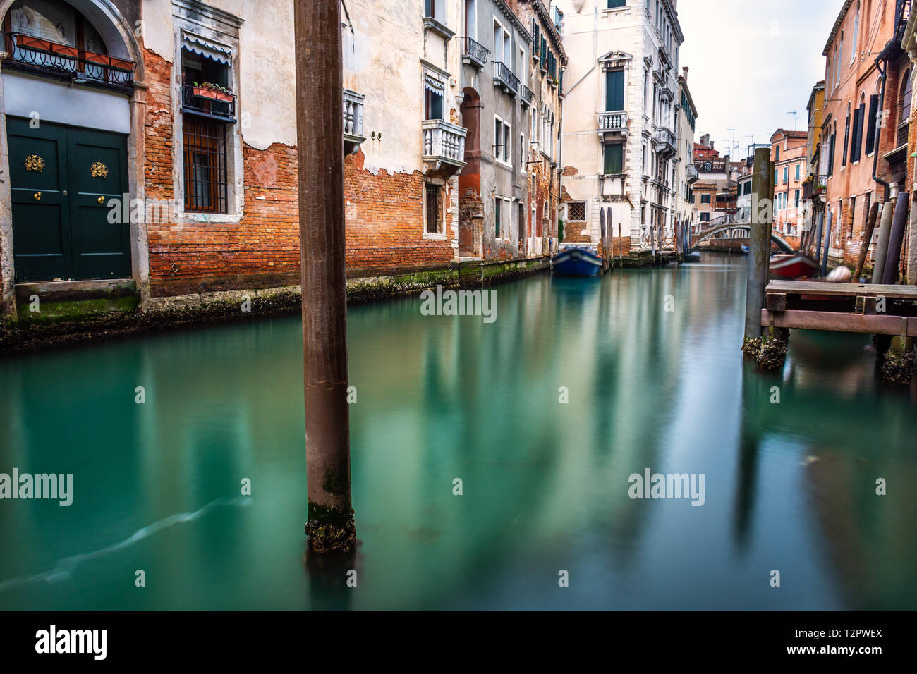 Canal in Venice with traditional old houses, Italy Stock Photo - Alamy