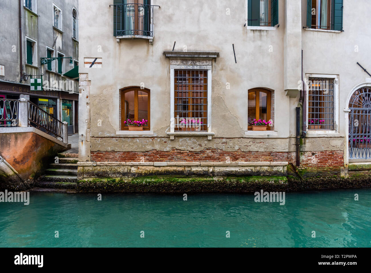 Canal in Venice with traditional old houses, Italy Stock Photo - Alamy