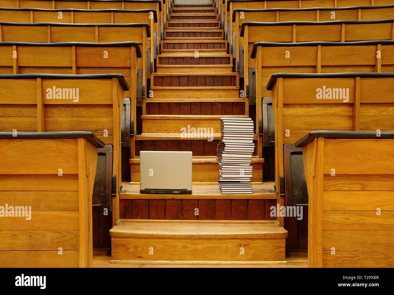 Laptop and books in traditional lecture hall at university Stock Photo ...