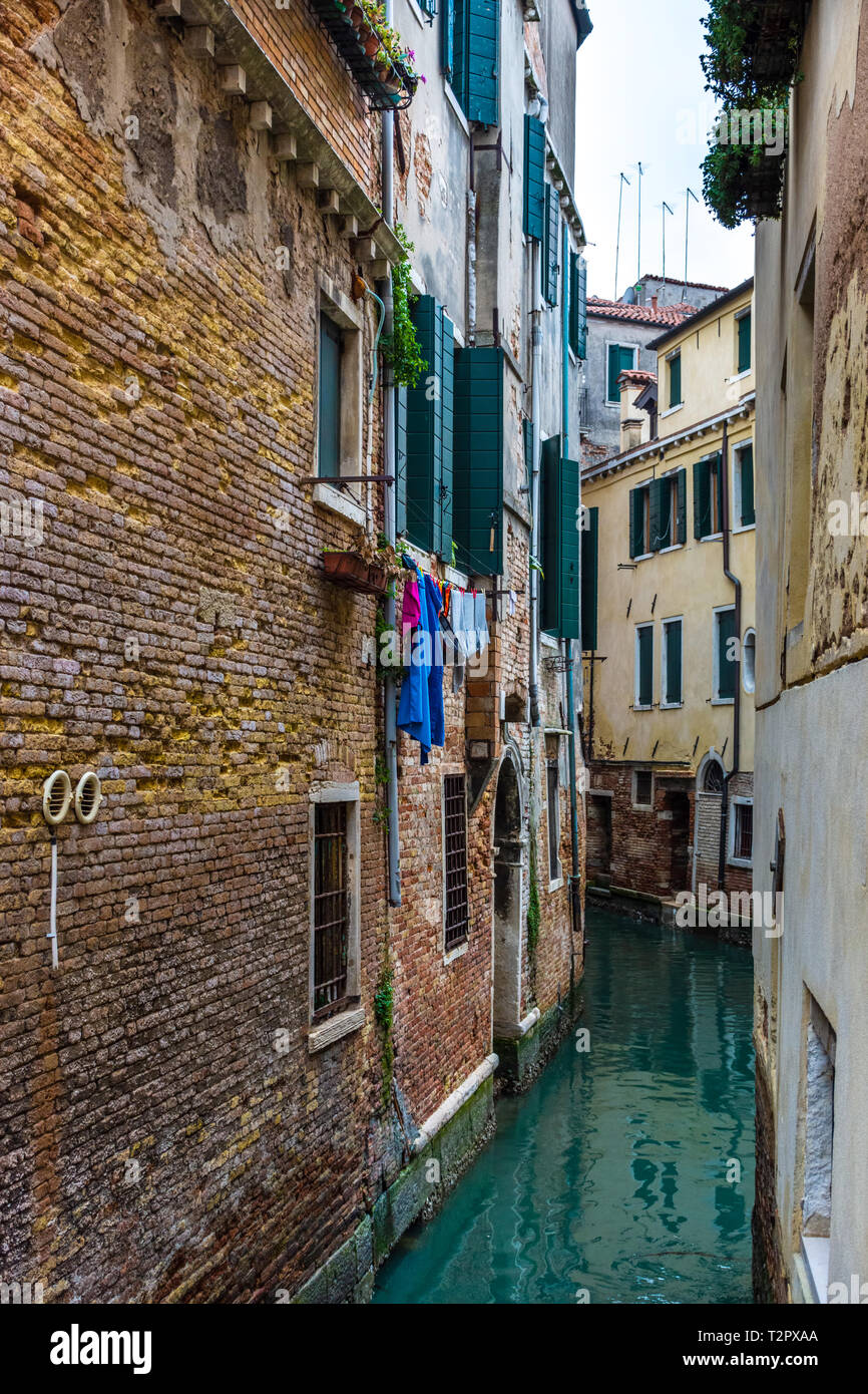 Canal in Venice with traditional old houses, Italy Stock Photo - Alamy