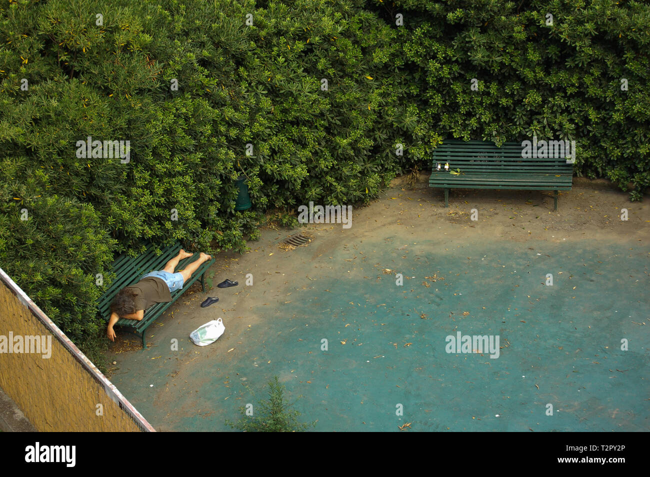 homeless man sleeping in a park Stock Photo Alamy