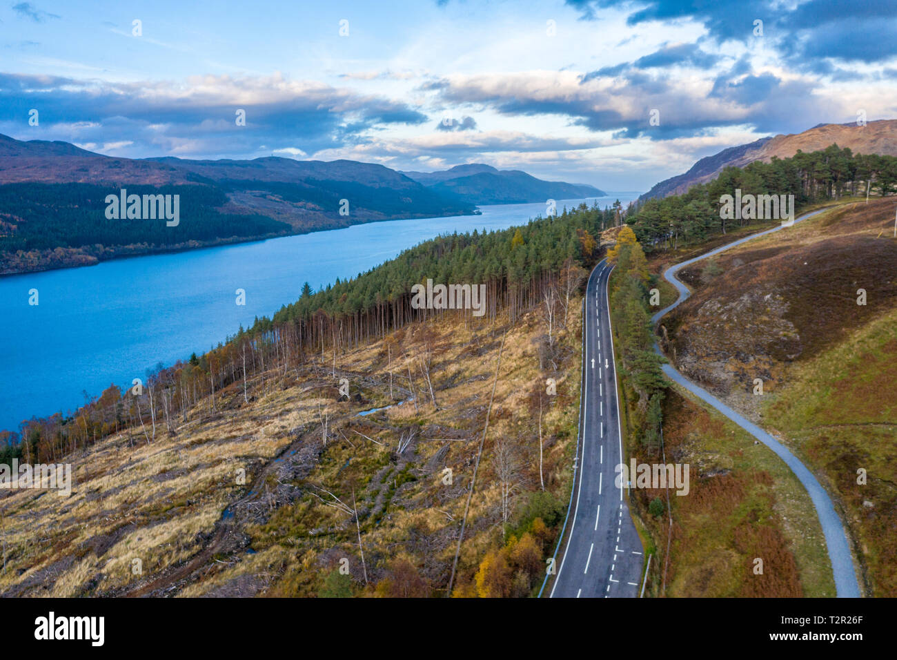 A road cuts through the hills near Loch Ness in Scotland, United Kingdom Stock Photo