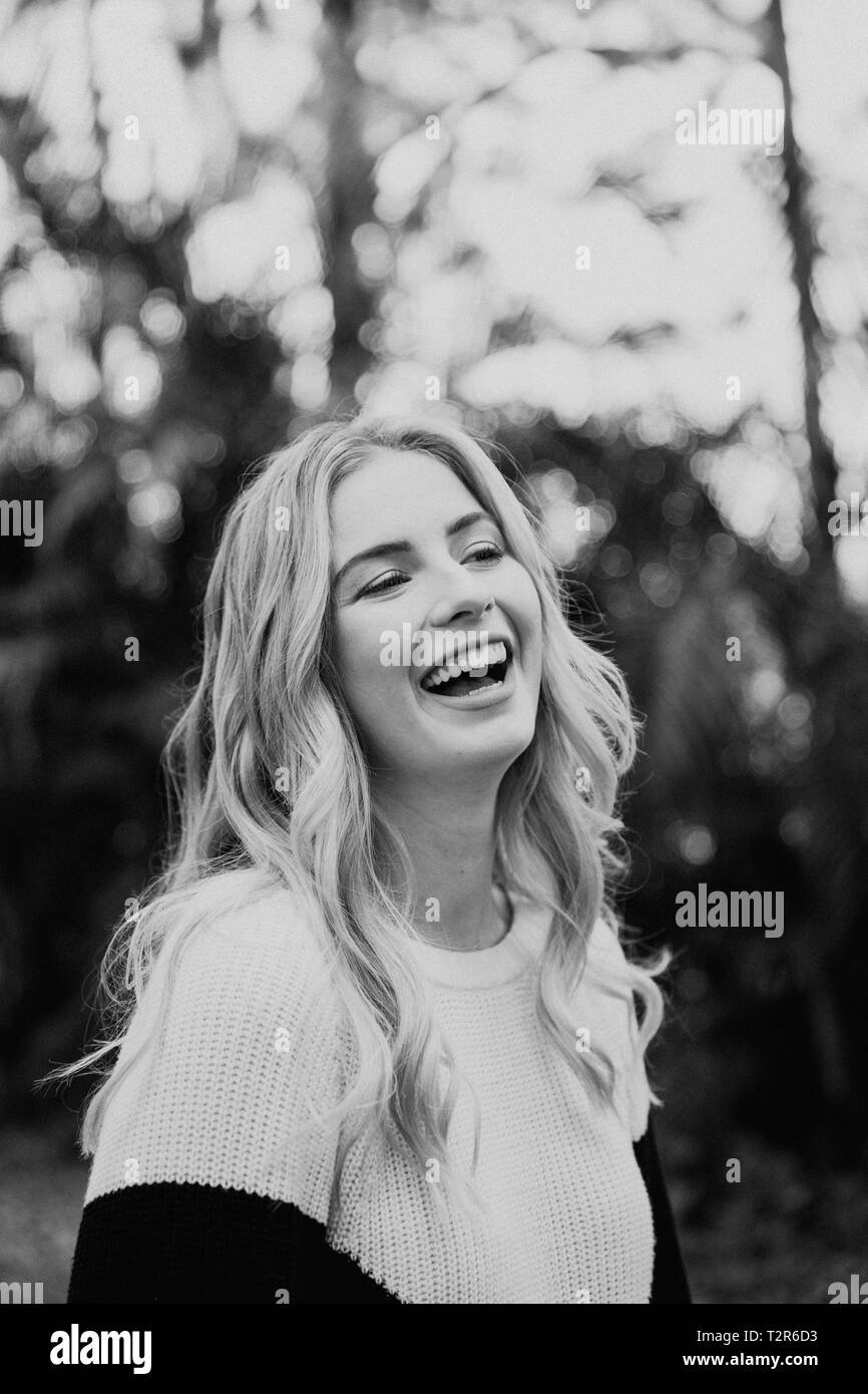 Beautiful Attractive Blond Hair Young Fair Skinned Caucasian Woman with Pretty Smile in Nature for Headshot Portraits Outside Stock Photo