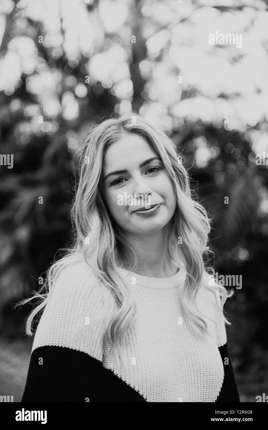 Beautiful Attractive Blond Hair Young Fair Skinned Caucasian Woman with Pretty Smile in Nature for Headshot Portraits Outside Stock Photo