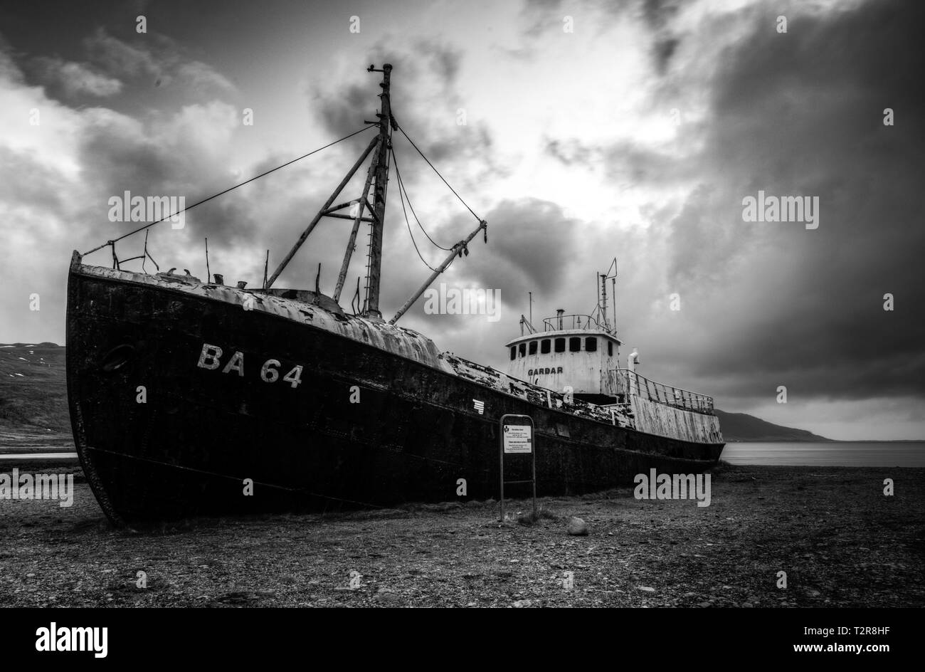 Garðar BA 64 is the oldest steel ship in Iceland and lies beached on the epic Westfjords, this image was taken during a moody sunset Stock Photo