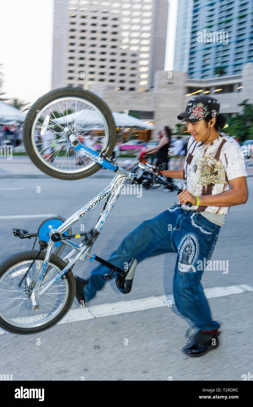 Miami Florida,Biscayne Boulevard,Asian Asians ethnic immigrant immigrants minority,adult adults man men male,young adult,freestyle BMX,street riding,b Stock Photo