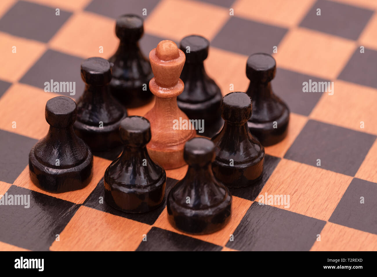 the king is surrounded by pawns Stock Photo