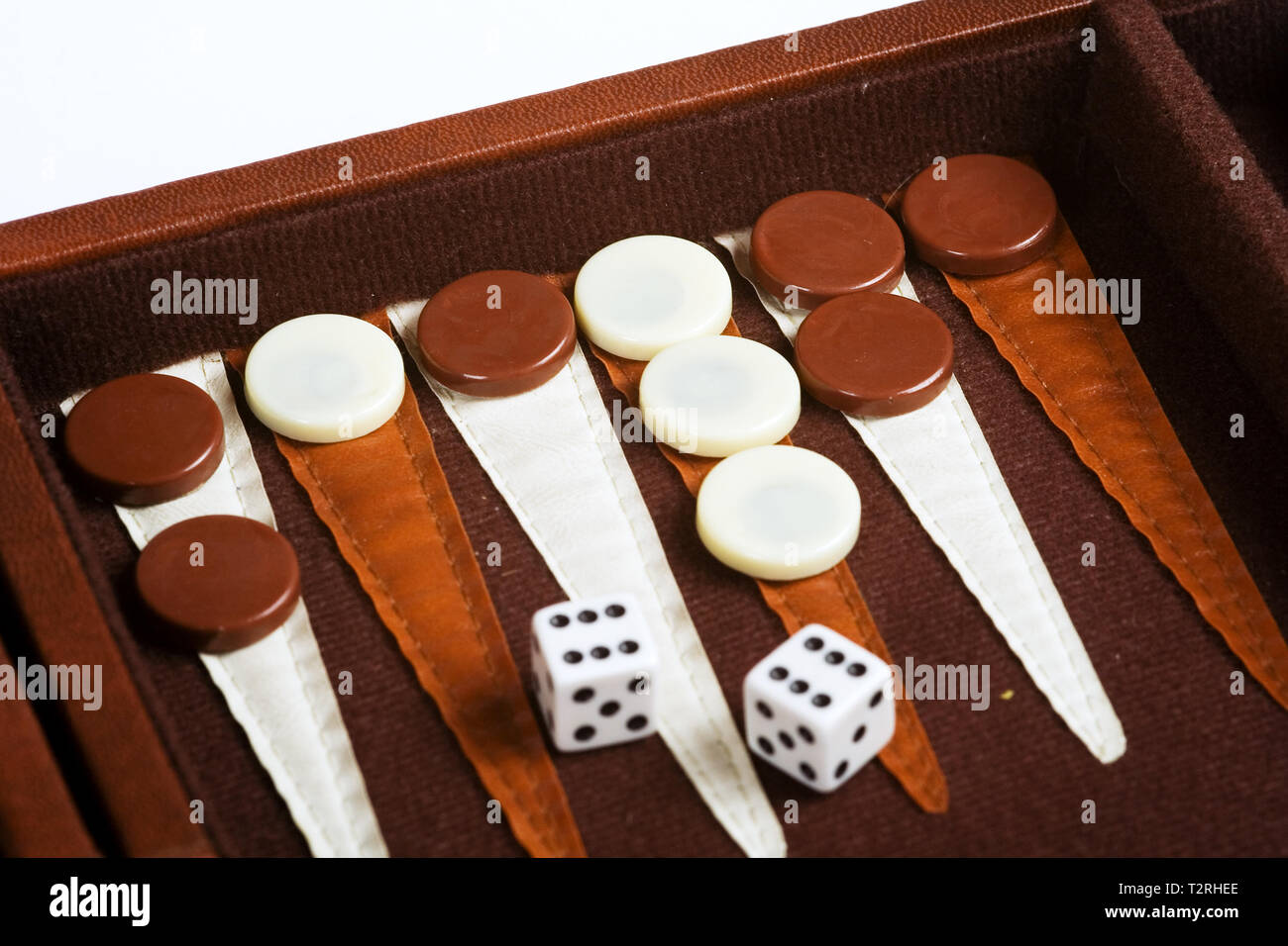 A backgammon game. Pieces and dice. Stock Photo
