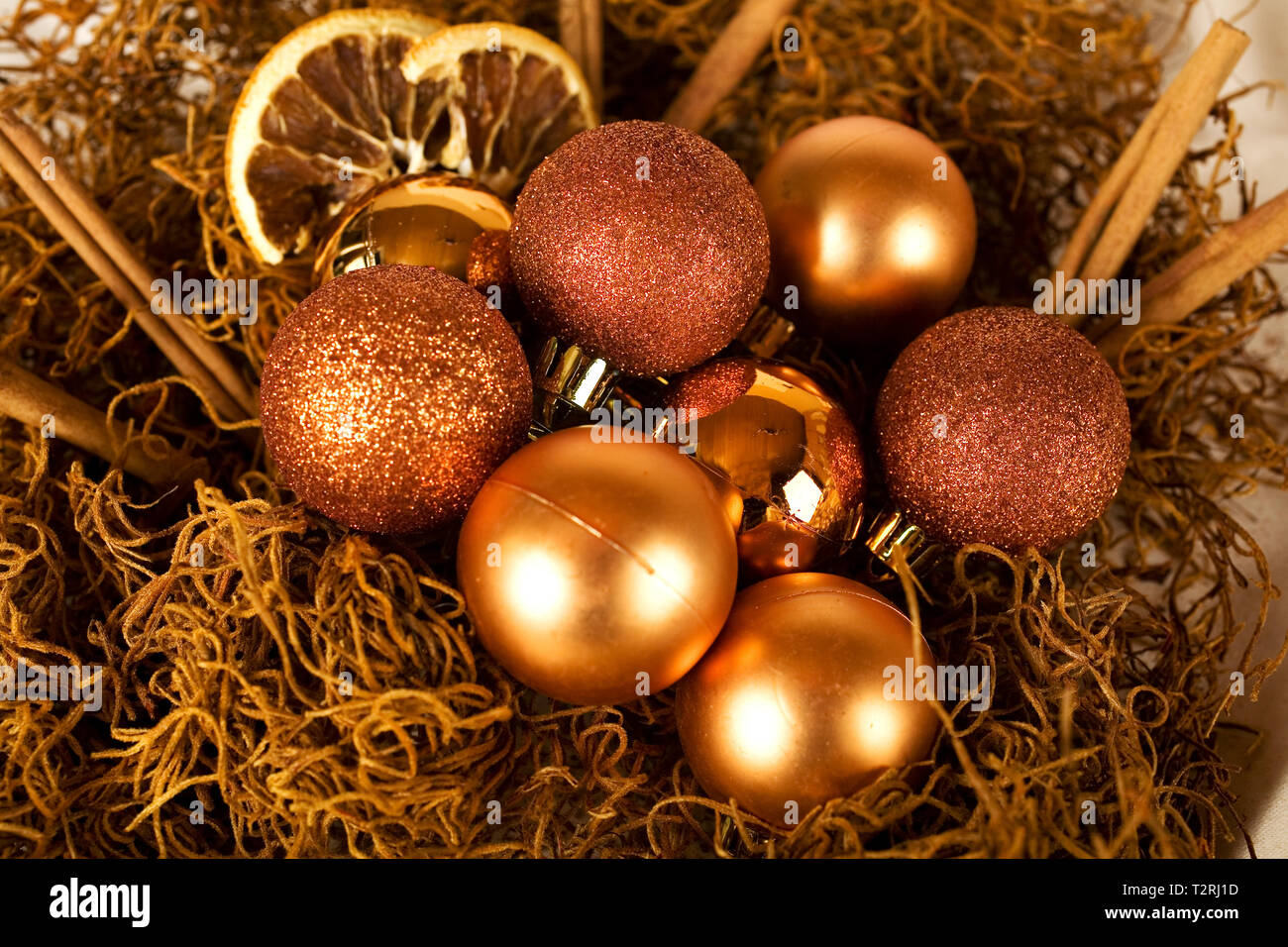 Christmas decoration with cinnamon sticks, orange slices and Christmas balls. Stock Photo