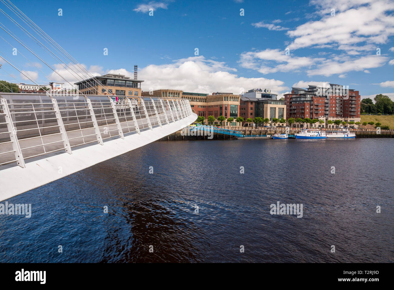 A close up view of the Millenium Bridge at Gateshead crossing the River Tyne in the north east of England Stock Photo