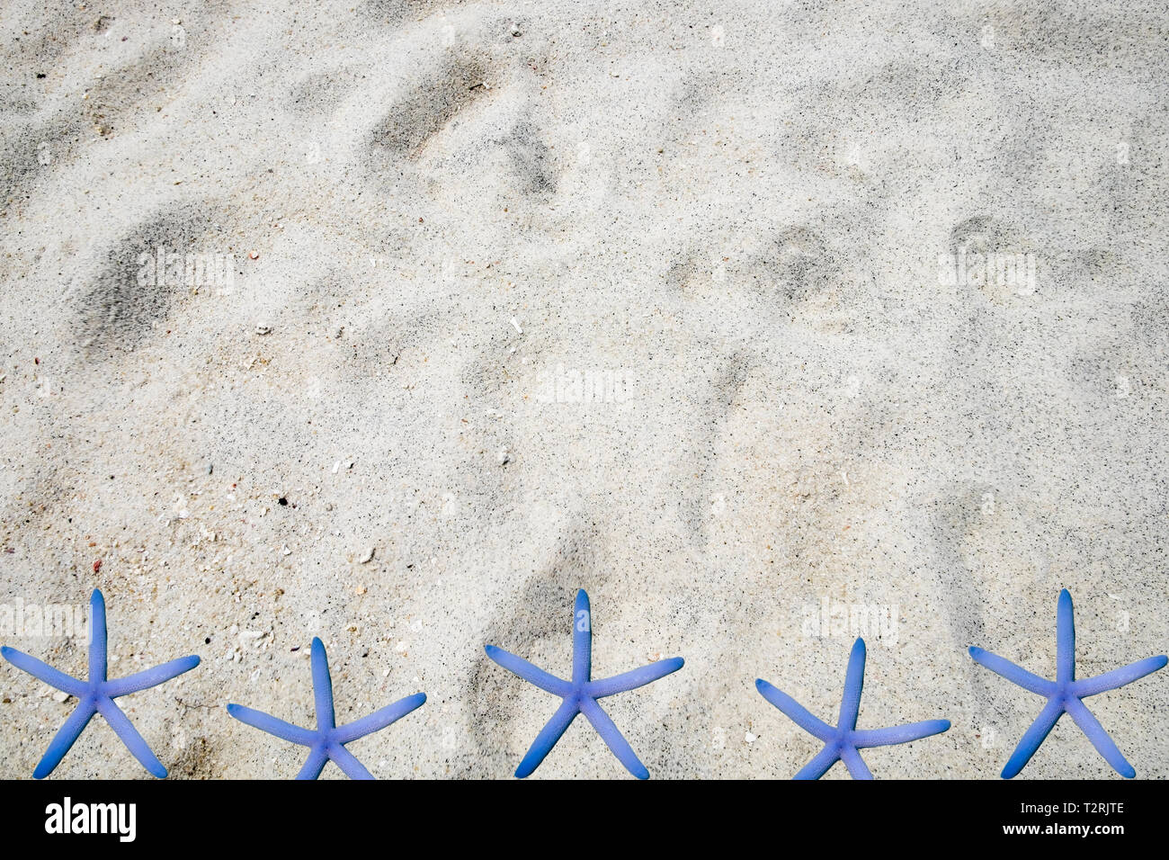 White sand subtle grain smooth with starfish background Stock Photo