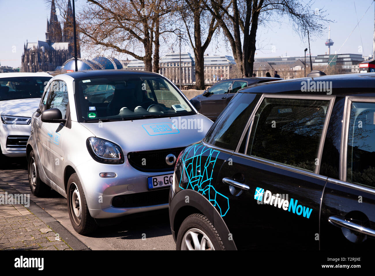 cars of the carsharing companies Drive Now and Car2Go in the district Deutz, Cologne, Germany.  Fahrzeuge der carsharing Unternehmen Drive Now und Car Stock Photo