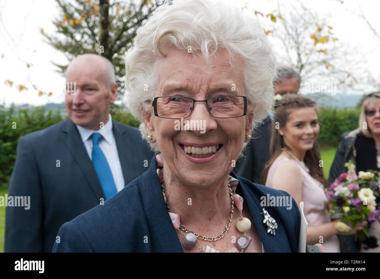 Portrait of happy smiling elderly woman at a special occasion Stock Photo