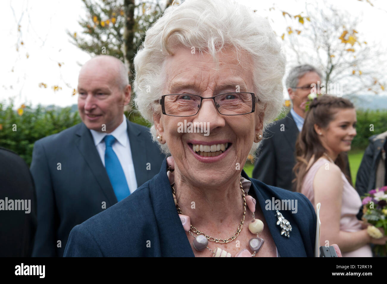 Portrait of happy smiling elderly woman at a special occasion Stock Photo