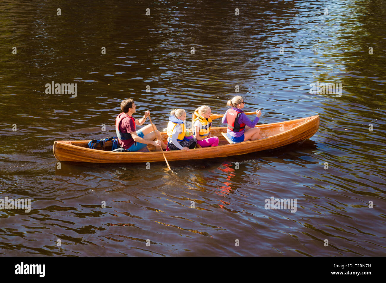 York, North Yorkshire. A family of canoeists on the River Ouse in York. Stock Photo