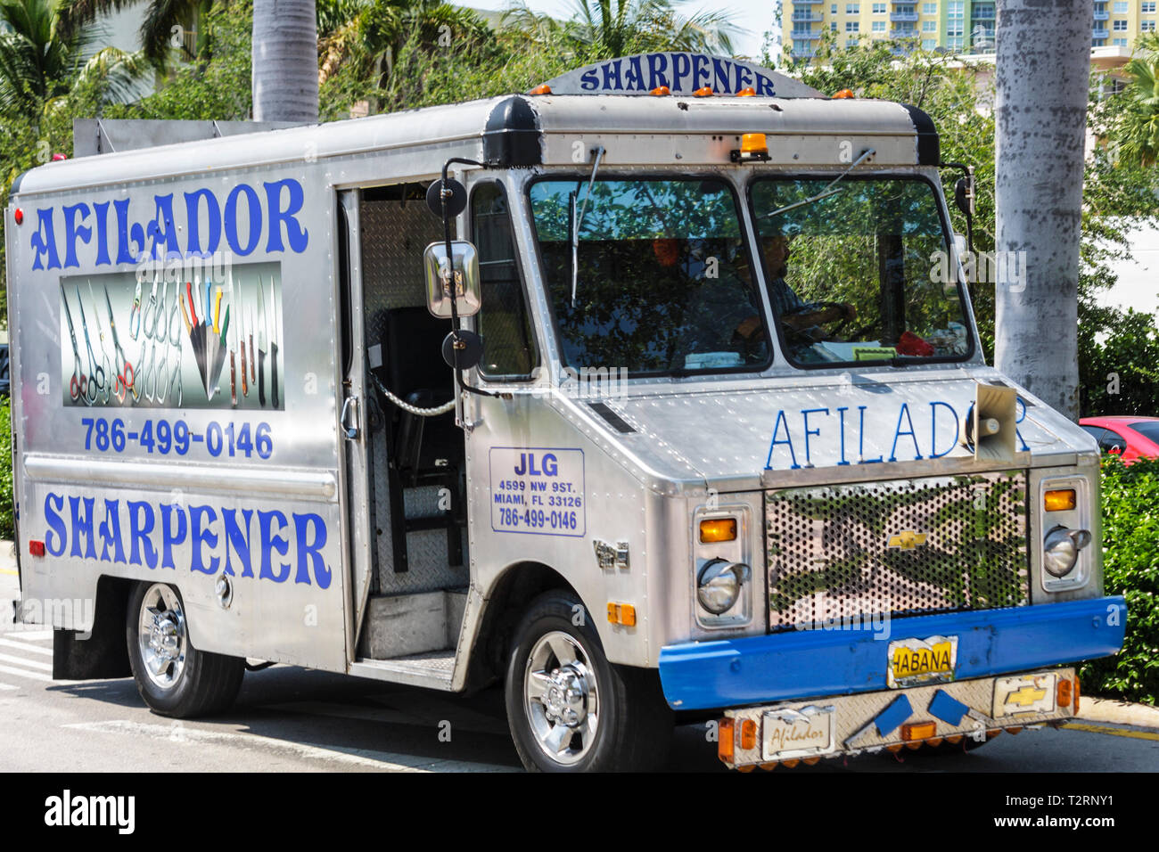 Miami Beach Florida,truck,parked,commercial vehicle,mobile service,metal tool sharpener,sharpening,afilador,sign,signs,Spanish language,bilingual,bili Stock Photo