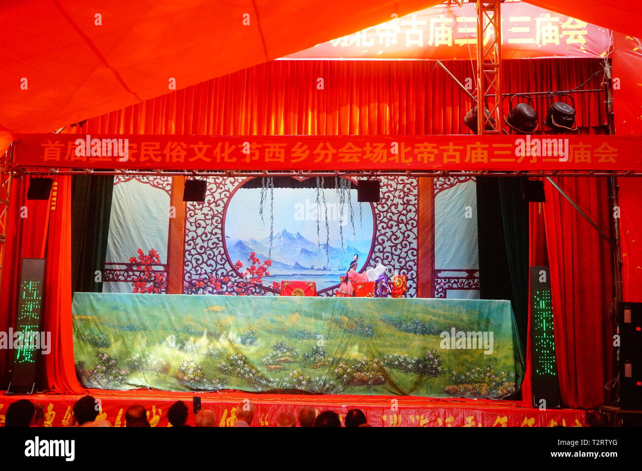 Shenzhen, China: people watch a traditional puppet show at the ...