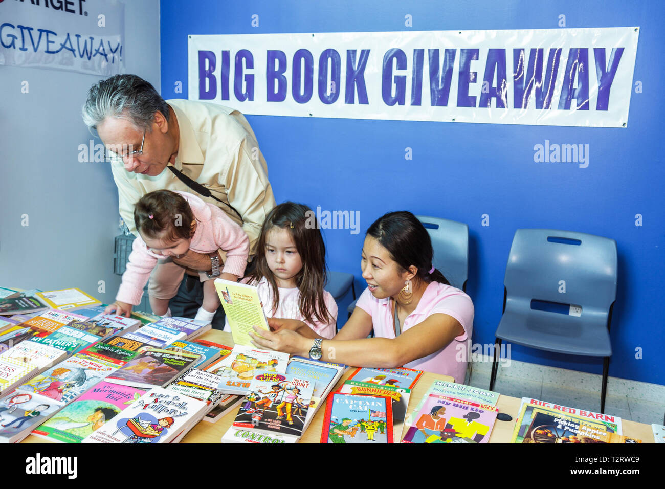 Florida Hollywood,Hollywood Branch Library,Children's BookFest,literature,book giveaway,Asian man men male,woman female women,girl girls,youngster,kid Stock Photo