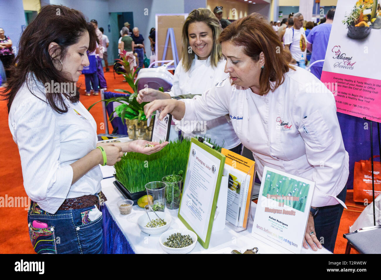 Miami Beach Florida,Miami Dade,Miami Beach Convention Center,centre,Health & Fitness Expo,exhibitor,Hispanic woman female women,chef,wheatgrass,sprout Stock Photo