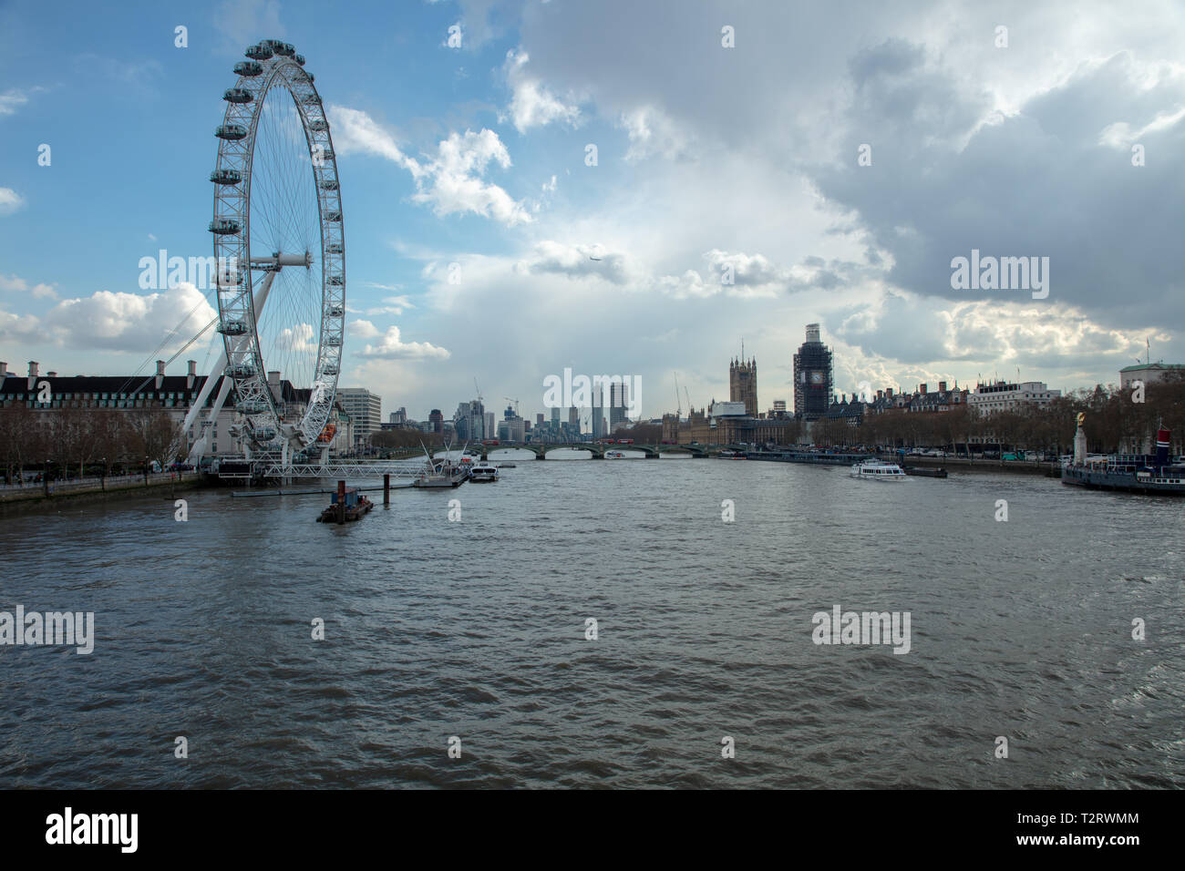 London Eye on the South Bank along the river Thames and other buildings along the river inland, towards the west. Stock Photo