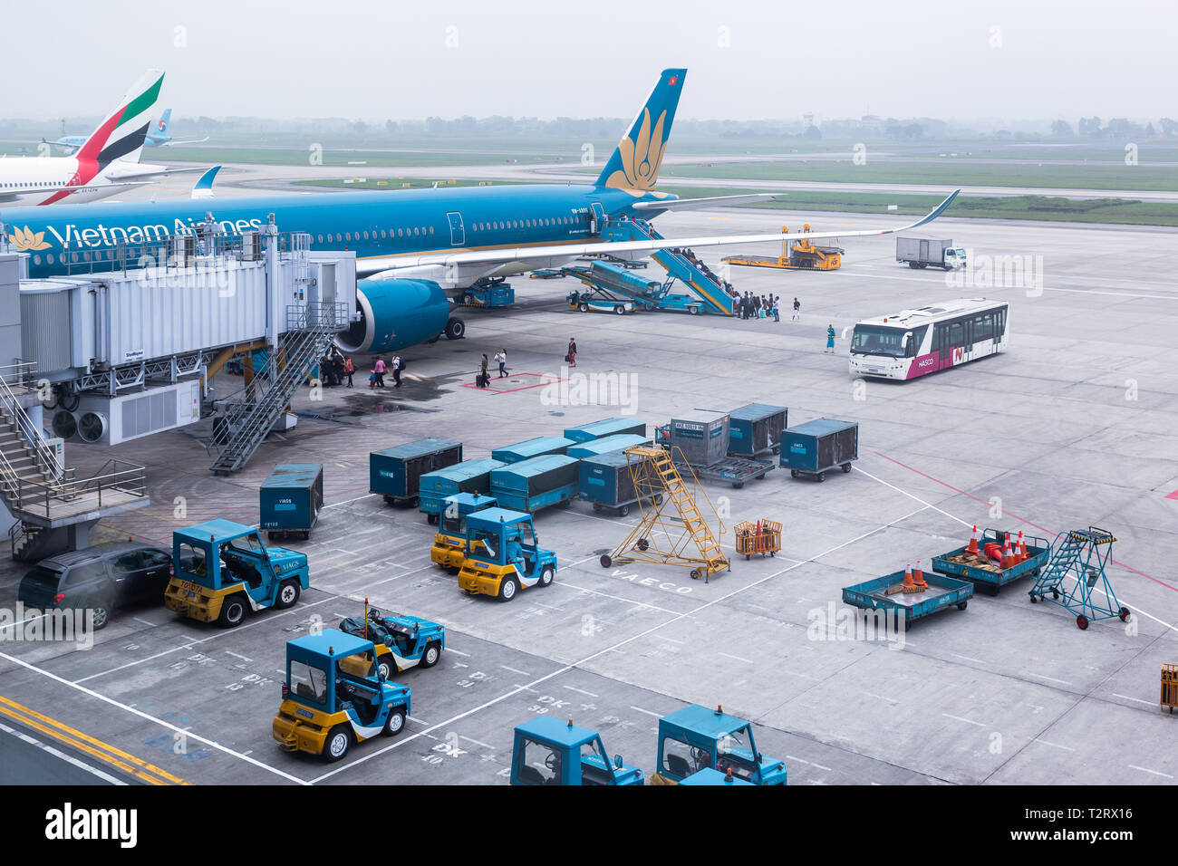 Vietnam Airlines aircraft loading air cargo containers before flight at