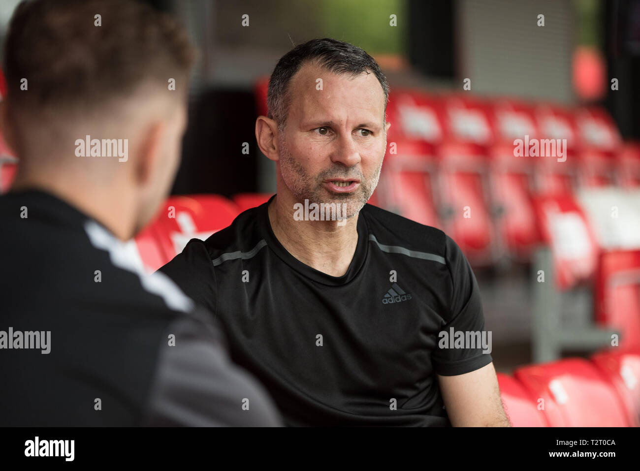 Salford City FC co-owner Ryan Giggs is interviewed at The Peninsula Stadium. Moor Lane Salford. Stock Photo