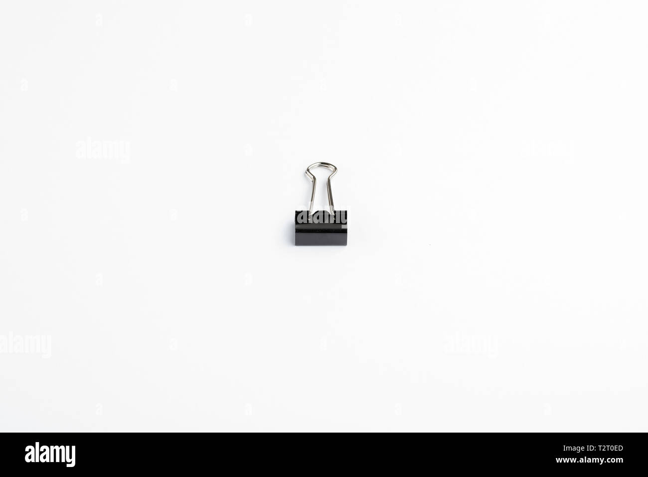 Single Bulldog Clip in Centre of White Background Stock Photo Alamy