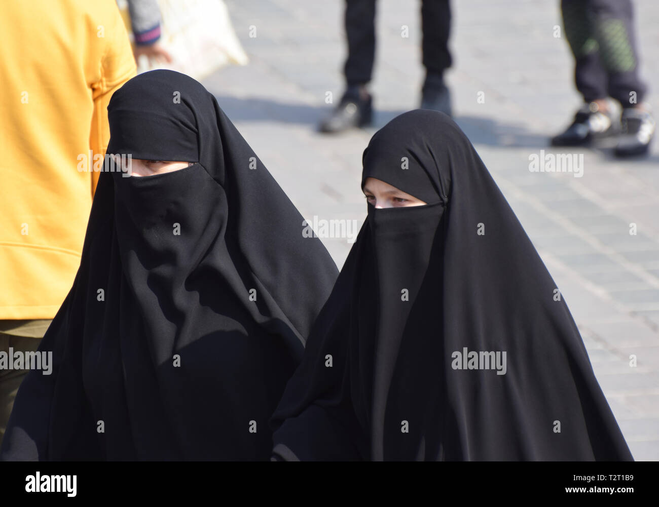 Two muslim woman wearing the full burqa and niqab Stock Photo
