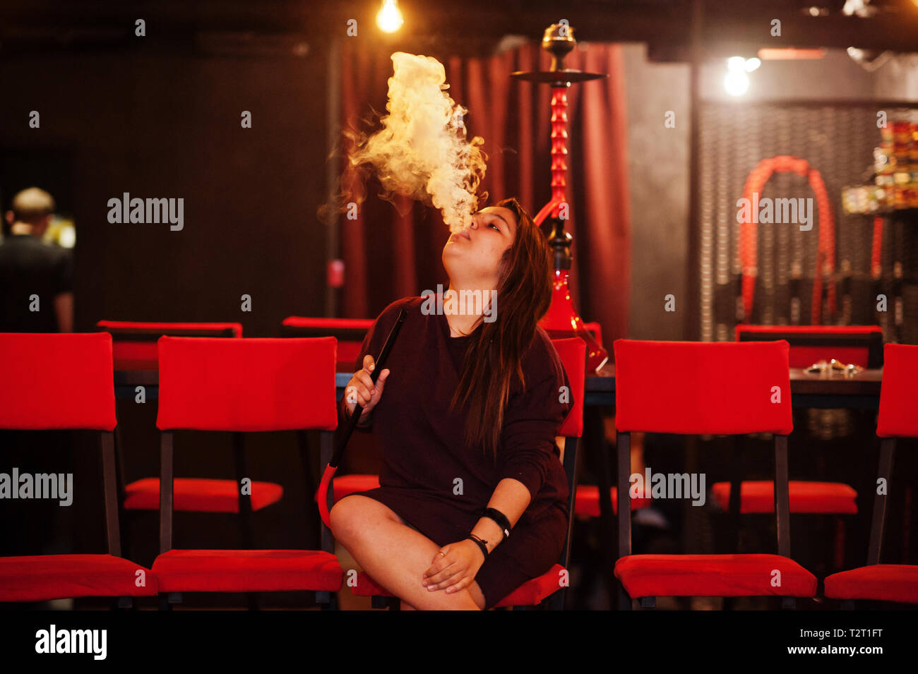 Asian girl smoke hookah at lounge bar Stock Photo Alamy